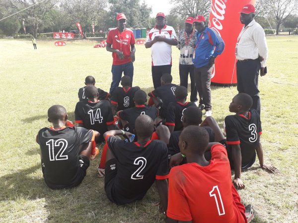 Kenya's Under 16 Boys soccer team take a rest during the half time break during their Quarter finals clash of the Copa Coca Cola Africa Championship today, kenya defeated Uganda 1-0 to book a semis clash.jpg