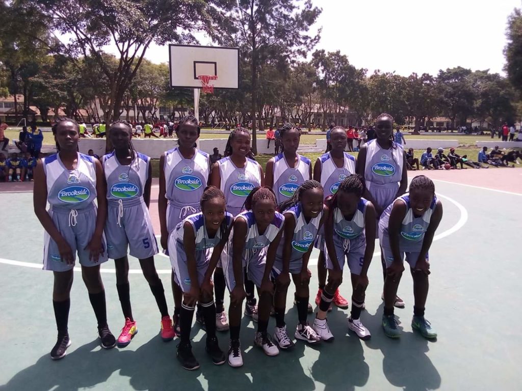 Kenya's Girls basketball champions, Buruburu, pose for a group photo after overcoming Rwanda's LDK 43-42 in a tough match played at St. Constantine in Arusha, Tanzania, today