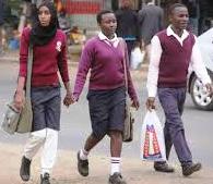 Learners walk home after schools were closed due to the outbreak of Covid-19 pandemic. The government is finding itaself within a hard place and a rock on making a decision whether to reopen schools soon or not.