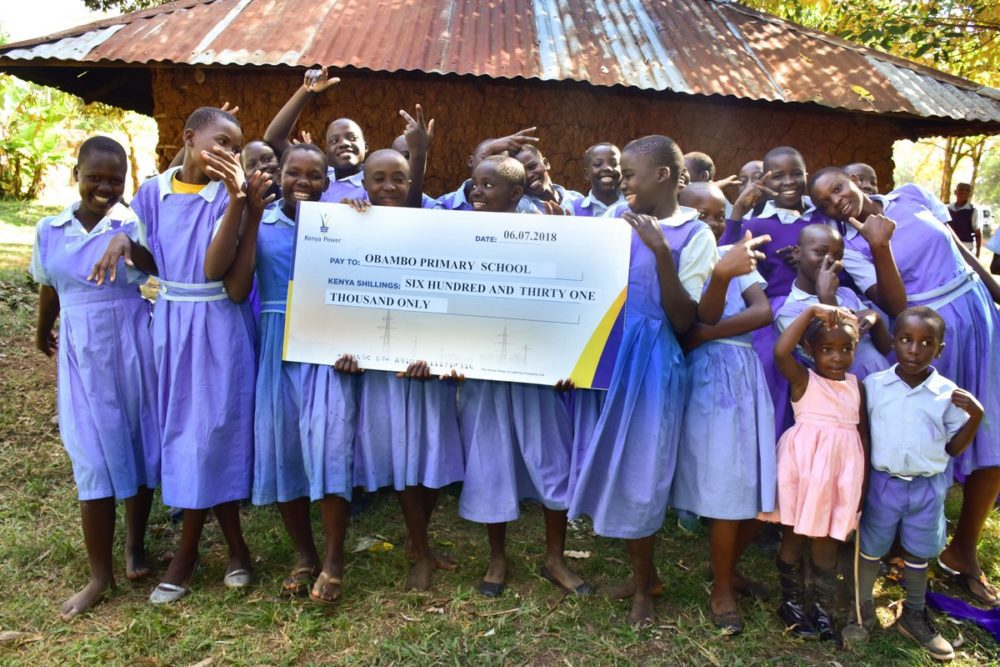 Obambo primary school pupils in ecstatic mood after receiving sponsorship from Kenya Power's 'Wezesha Jamii' programme