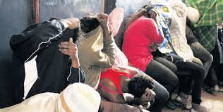 Photo (Courtesy)- Some of the arrested students in Bomet engaging in alcohol drinking and sex party.