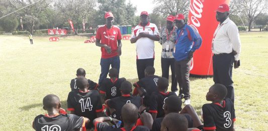 Kenya's Under 16 Boys soccer team take a rest during the half time break during their Quarter finals clash of the Copa Coca Cola Africa Championship today, kenya defeated Uganda 1-0 to book a semis clash.jpg