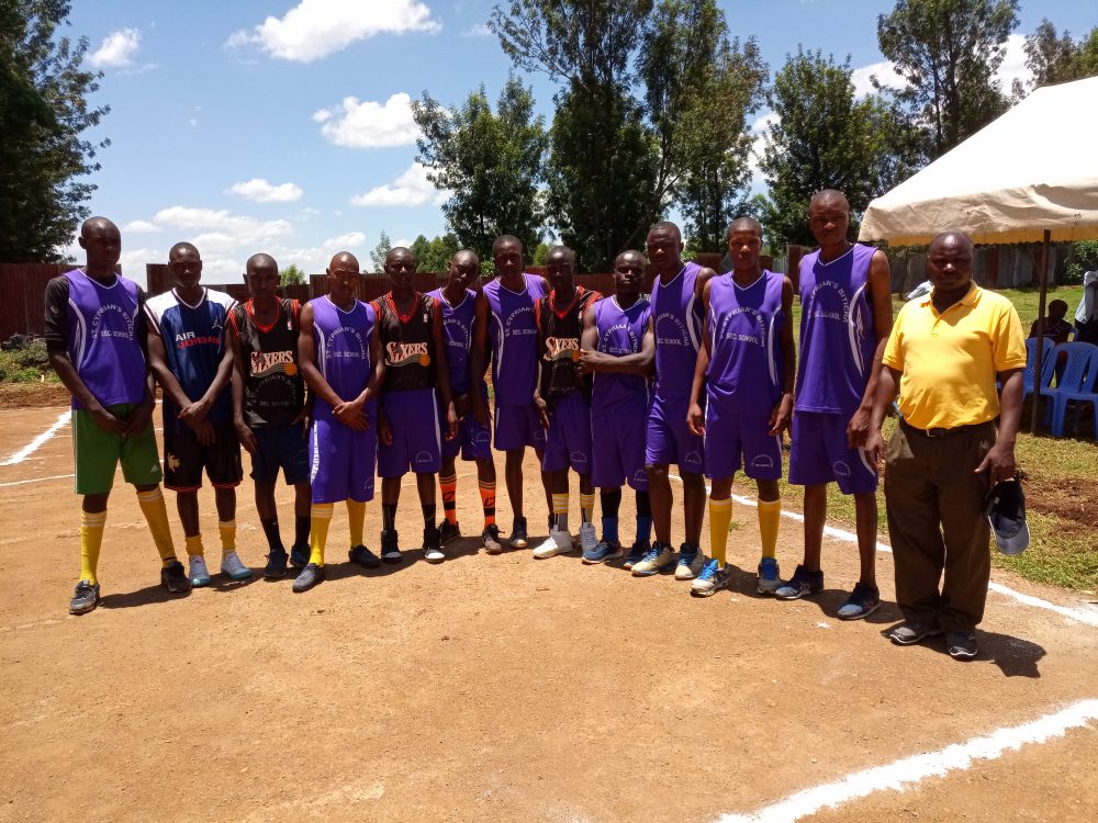 Biticha Secondary's boys basketball team pose for a group photo before facing Omonayo Secondary, today. Biticha won the match by a 30- 24 margin.