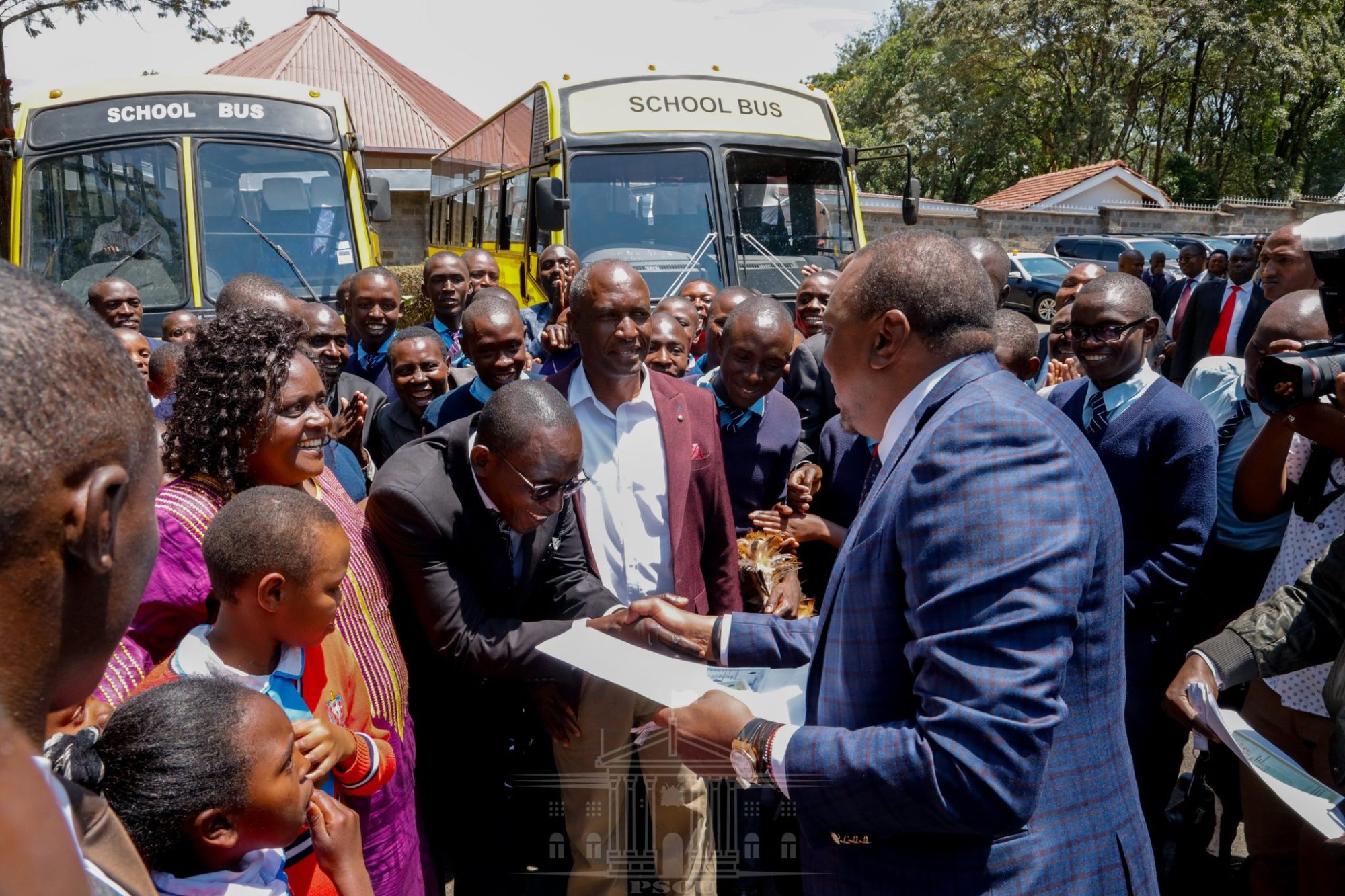 President Kenyatta handing over 52-seater buses to Mary Immaculate Academy and Nyachogochogo High School at State House, Nakuru, on Wednesday August 14, 2019. The President also donated indigenous tree seedlings to the schools and challenged them to be mindful and look after the environment.