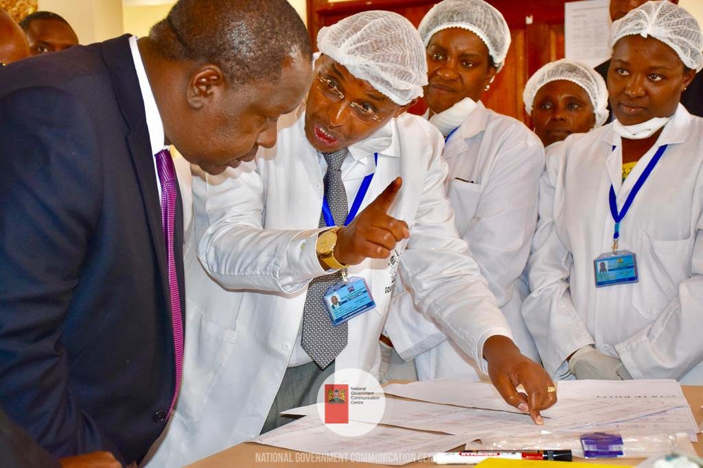 Interior CS Dr Fred Matiang'i, in black coat, when he unveiled the new Genetic Analyzers. The 3500xL Genetic Analyzer acquired by the Government Chemist's Department can analyse several DNA samples collected from crime scenes.