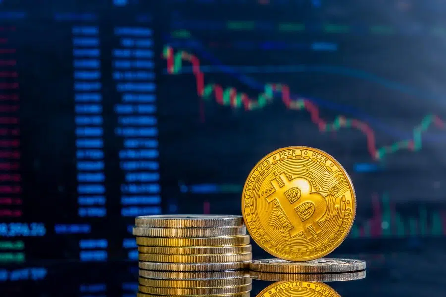 Golden bitcoins dark reflective surface histogram decreasing crypto Golden bitcoins dark reflective surface histogram decreasing crypto