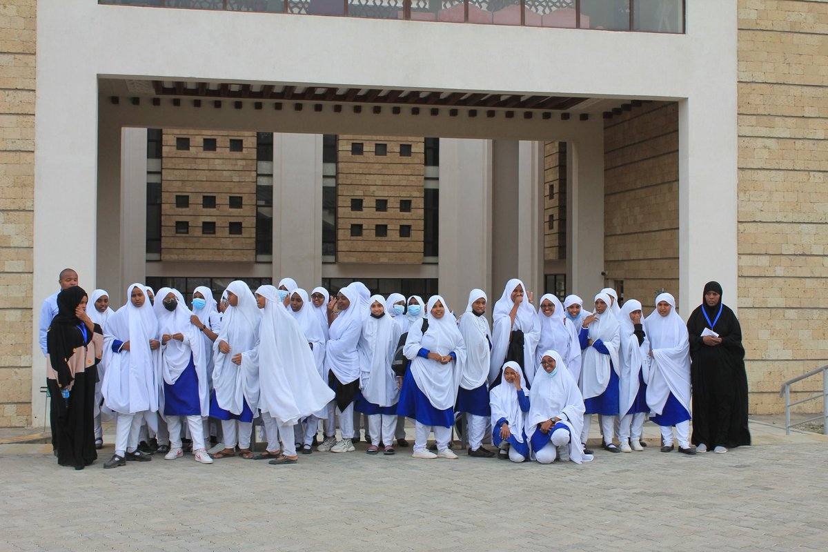 GHANIMA EL-MARZUQ GIRLS SECONDARY SCHOOL- KAJIADO Here’s a detailed profile of Ghanima El-Marzuq Girls Secondary School in Kenya covering history, background, status, academic performance, staff and leadership, co-curricular activities, facilities, and national status based on available verified information. --- 1. School Profile & Background Ghanima El-Marzuq Girls Secondary School is a girls’ secondary boarding school located in Kajiado County, Kenya. It was established to provide quality education to girls, especially those from underprivileged and vulnerable backgrounds. The school is associated with the support of Direct Aid Kenya, a non-profit organization that helps vulnerable communities access education and other services. The school is named in honor of Ghanima Fahad Al-Marzuq, commemorating her contributions to charity and education through the Direct Aid Society. Plans for the school’s establishment date back to discussions and announcements around 2013–2015, with the aim of creating a model girls’ school as part of humanitarian and educational support initiatives by the organization. It serves students from Kajiado and neighboring counties, focusing on both academic excellence and holistic development. --- 2. Status & Classification Type: Secondary school (high school), girls only Boarding status: Full boarding institution Sponsorship: Supported by Direct Aid Kenya (private/NGO-supported model); not a typical fully government-run public school — classified as a private or NGO-supported secondary school within Kenya’s education system. Curriculum: Kenyan Secondary Education Curriculum leading to the Kenya Certificate of Secondary Education (KCSE) Because the school is supported by non-profit sponsorship rather than being fully government-funded, it may not be listed with the same national category labels (e.g., National, Extra-County, County) used by the Ministry of Education for public schools — though it participates fully in national examinations and education standards. --- 3. Academic Performance – KCSE 2025 & Previous Years 2025 KCSE Results In the 2025 Kenya Certificate of Secondary Education (KCSE), Ghanima El-Marzuq Girls posted excellent performance, emerging as the top-performing school in Kajiado County: Mean score: 9.32 points This was a significant improvement from the 7.42 mean in 2024. Grade distribution included: 1 student with A plain 6 with A- 22 with B+, 14 B, 14 B-, 2 with C+. Most candidates achieved high grades, demonstrating strong academic performance across subjects. Previous Years 2024 KCSE: Mean score was 7.42, showing strong improvement by 2025. Detailed year-by-year breakdowns (e.g., subject by subject) aren’t published online but are typically available from the school’s administration or the Teachers Service Commission (TSC) records. --- 4. Staff & Leadership Principal The Principal (Head of School) is Barika Salim, who publicly commented on the 2025 results and achievements, crediting discipline, teamwork and commitment from students and teachers for success. Teaching & Administrative Staff There isn’t a full publicly accessible staff list available online, but staff typically include: Teachers across subjects like English, Mathematics, Sciences, Humanities, Languages, etc. Administrative and support personnel. Leadership roles such as Deputy Principal and Heads of Departments usually exist, especially in models tied to organizations like Direct Aid Kenya. For exact staff names and roles, you would need to contact the school directly (either through their office or via an official contact email/phone). --- 5. Co-Curricular Activities While specific event records aren’t widely published, the school — like most Kenyan secondary schools — engages learners in co-curricular life including: Debate, drama and public speaking events (common in secondary schools and often encouraged by sponsors like Direct Aid). Sports activities, such as volleyball, football, athletics, netball and other games. Educational tours and leadership exposure, as evidenced by visits to higher education institutions like the Islamic University of Kenya to guide students in career pathway planning. Community engagements and character-building activities supported by stakeholders and partners. To get specific lists of trophies, competition placements, and achievements in co-curricular activities, contacting the school’s sports and activities department is recommended. --- 6. Facilities & Infrastructure Exact published details on all facilities aren’t available, but boarding schools of this type typically provide: Classrooms and tutorial blocks for academic instruction. Boarding dormitories — accommodation for students. Dining hall / cafeteria for meals. Library / study spaces for reading and research. Sports grounds and courts for ball games and athletics. Science laboratories to support practical learning (availability may vary). Because the school is tied to philanthropic support from Direct Aid Kenya, facilities may include structures funded or upgraded through partner support — though there’s no official comprehensive facilities list online. For exact capacity (e.g., number of dorms, labs, library size), you would need to request the school’s prospectus or visit in person. --- 7. National Status National ranking/recognition: In KCSE 2025, Ghanima El-Marzuq Girls was the top school in Kajiado County, outperforming many established schools locally. At the national level, while not classified as a national school by the Ministry of Education (like state-run elite schools), its 2025 performance makes it notable and competitive academically. Because it’s supported by Direct Aid Kenya and runs as a private/NGO-supported secondary school, its “national status” isn’t the same classification used for government schools (e.g., National, Extra-County, County), but academically it has earned recognition for achievement within its region. --- Ghanima El-Marzuq Girls Senior School’s Complete Details